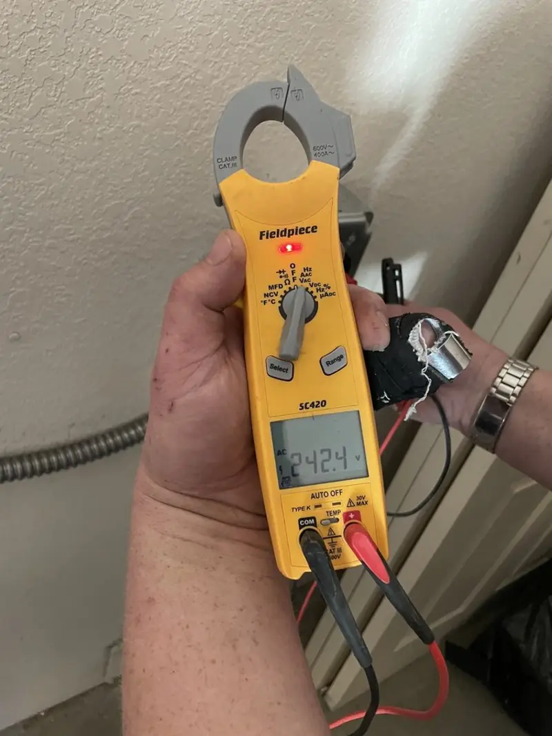 Voltage testing with clamp meter during Ceiling Fan Installation in West Orange
